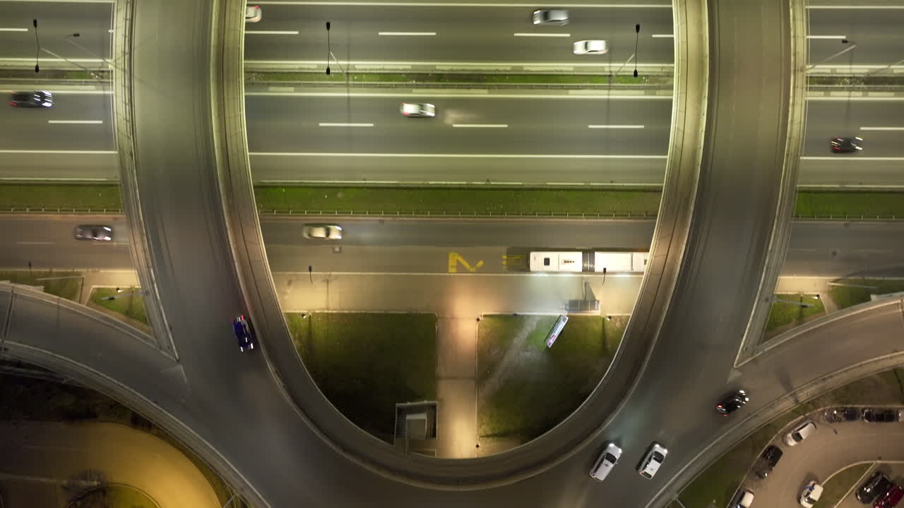 Aerial Night View of a Busy Highway Interchange with Cars