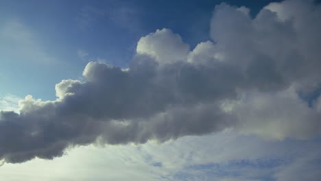 smoke from industrial plant against a blue sky with clouds