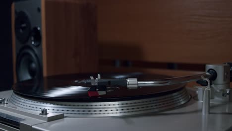 A Man Changing the Side of the Vinyl and Putting the Turntable Needle on to Start the Music