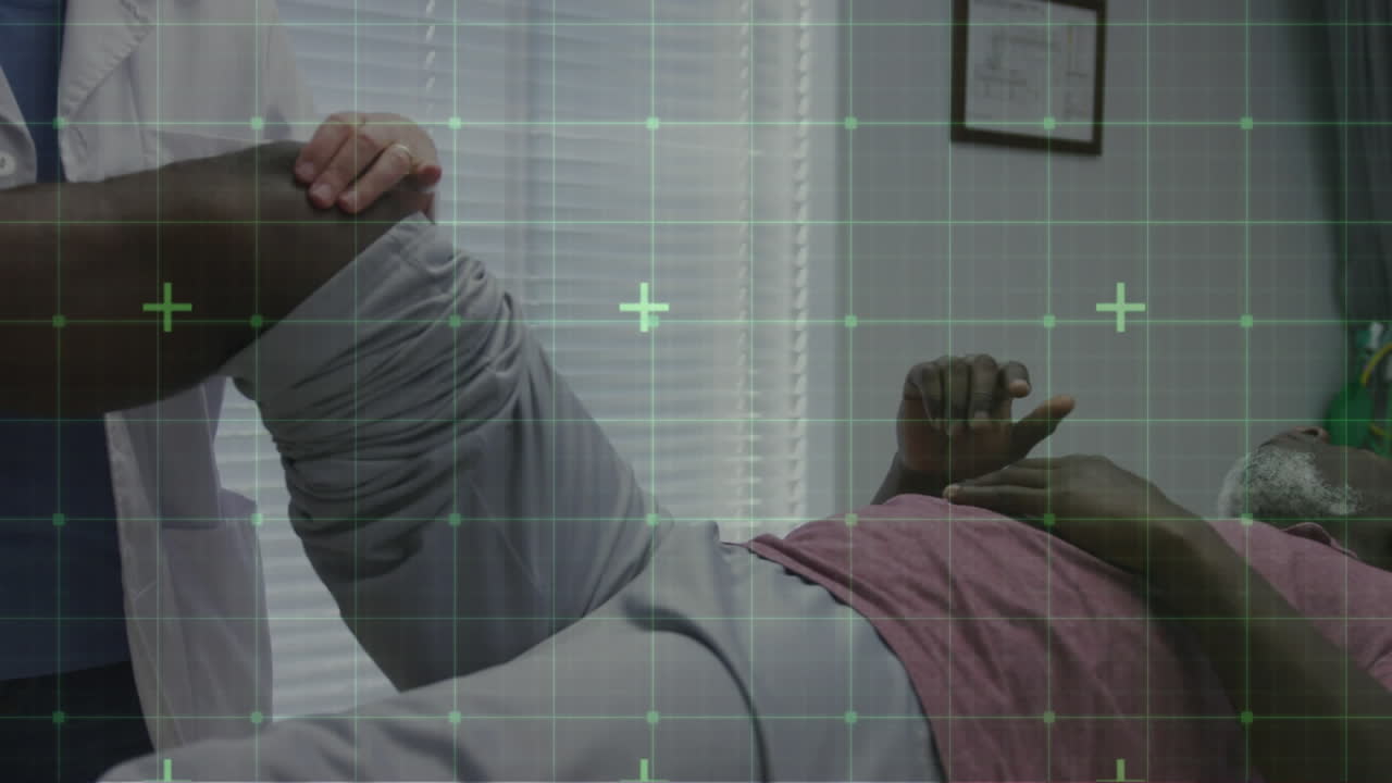 Animation of grid with green markers over female physiotherapist and senior male patient