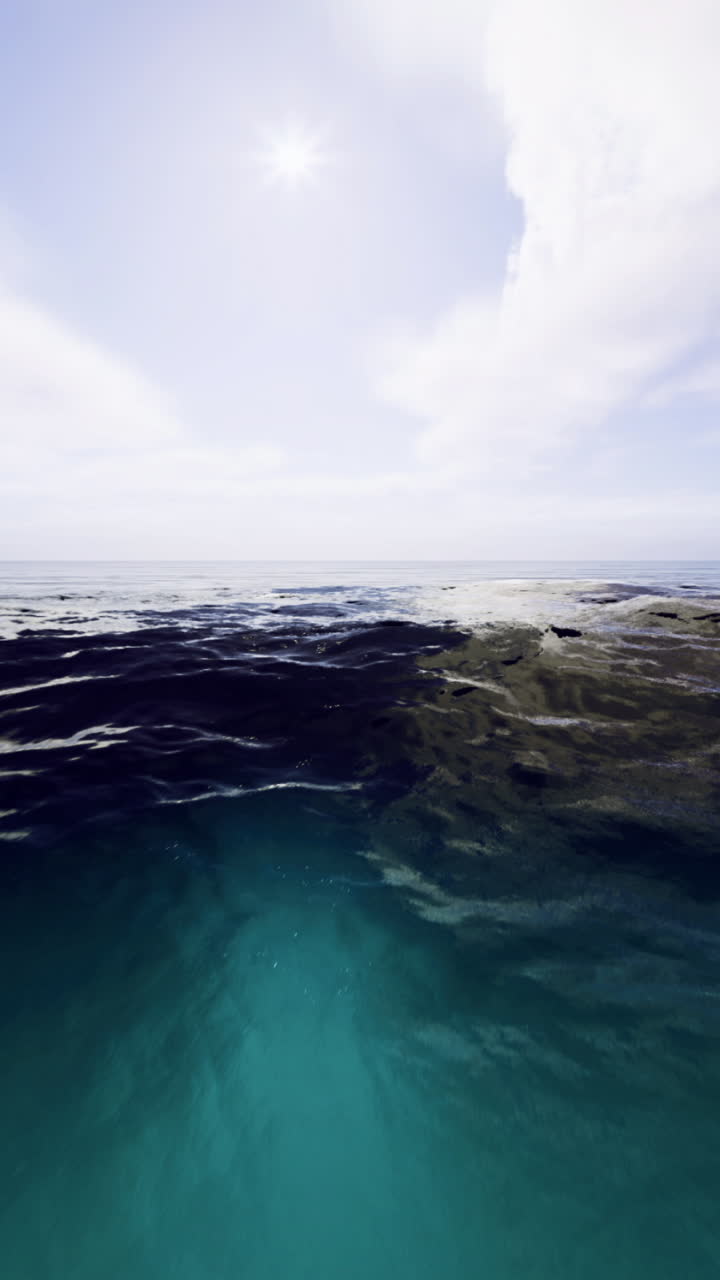 Ocean waves rolling under a bright sky at midday