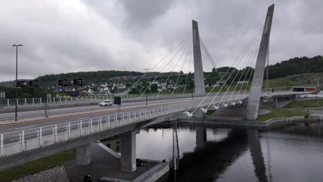 Aerial-View-of-Cars-Driving-Through-The-Bridge-Over-The-Farris-Lake-In-Larvik,-Norway