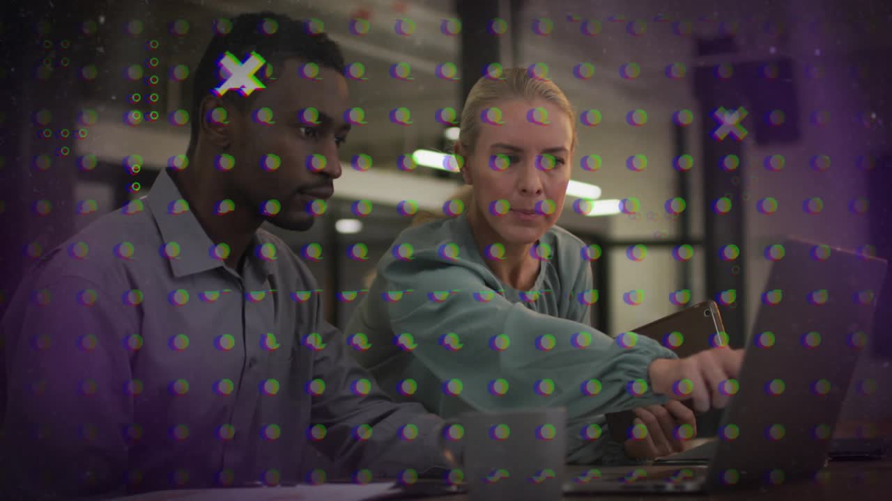 Consultant tapping laptop pointing charts illustrating business metrics analyst observing