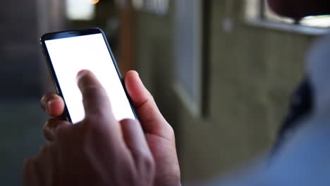 Mixed-race-businessman-swiping-smartphone-screen,-close-up