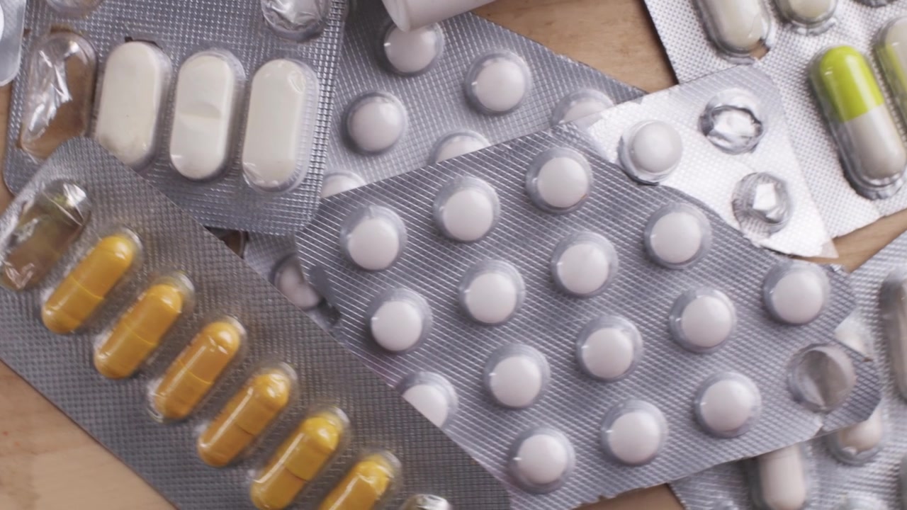 Assortment of Pharmaceutical Blister Packs with Pills and Empty Slots