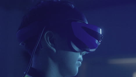 closeup of young man wearing virtual reality headset