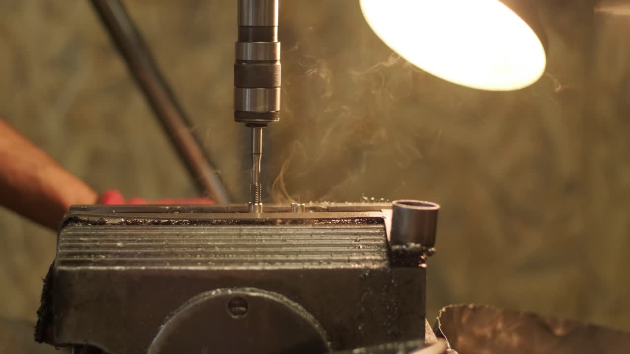 Drilling machine with drill bit for tapping