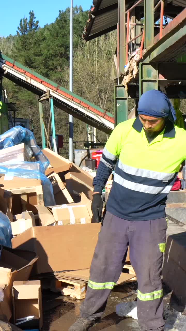 Recycling Worker Sorting Cardboard