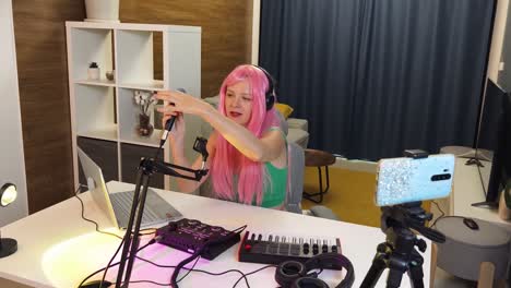 woman recording music in home studio