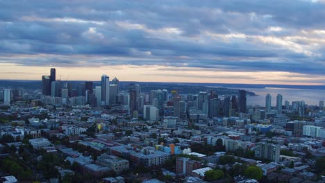 aerial pulling away from seattle's developing skyscrapers, circa 2016.