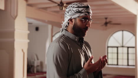 muslim man praying in a mosque
