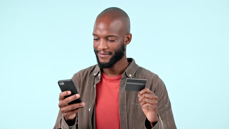 phone, credit card and black man online shopping