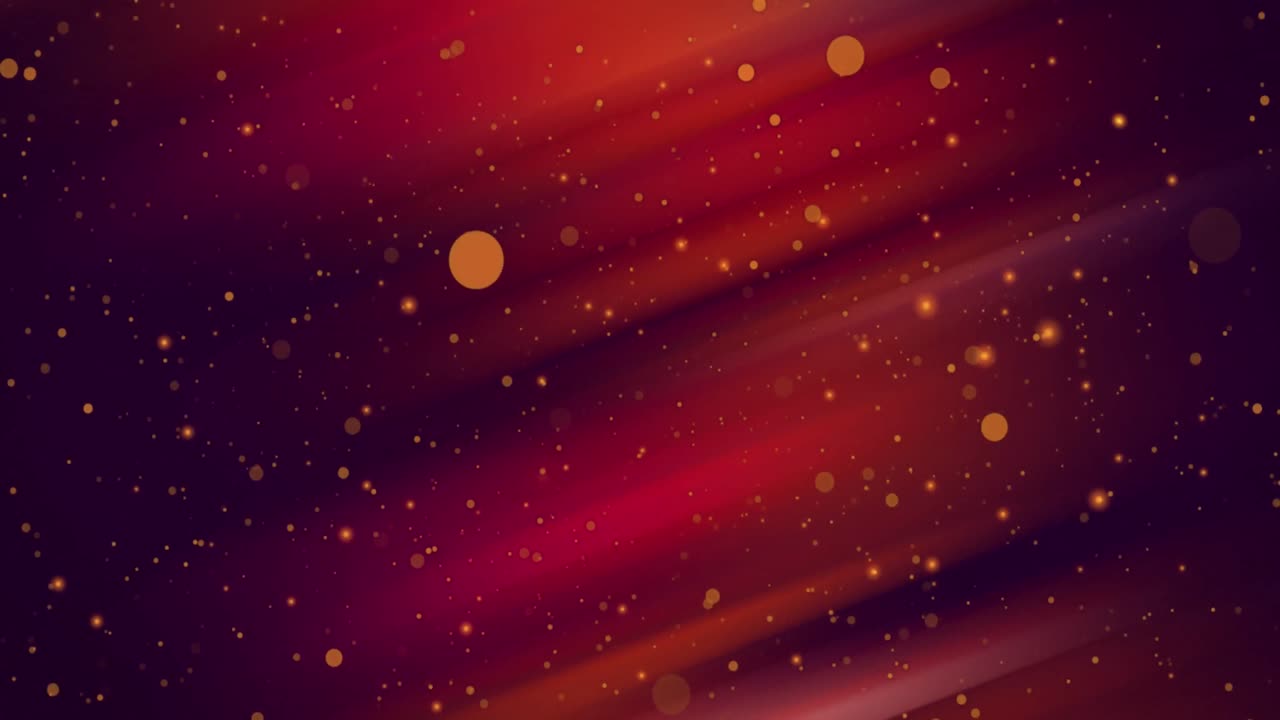 manchas de luz amarillas brillantes y bokeh que se mueven sobre un resplandor rojo sobre un fondo negro