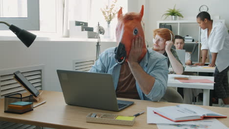 funny office scene with horse mask