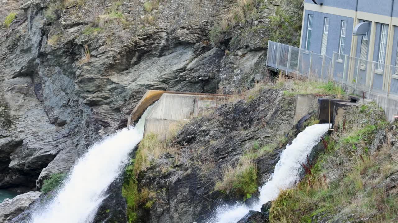 Water rushes through a hydroelectric station in Queenstown, New Zealand. Captured with steady lighting and dynamic water movement