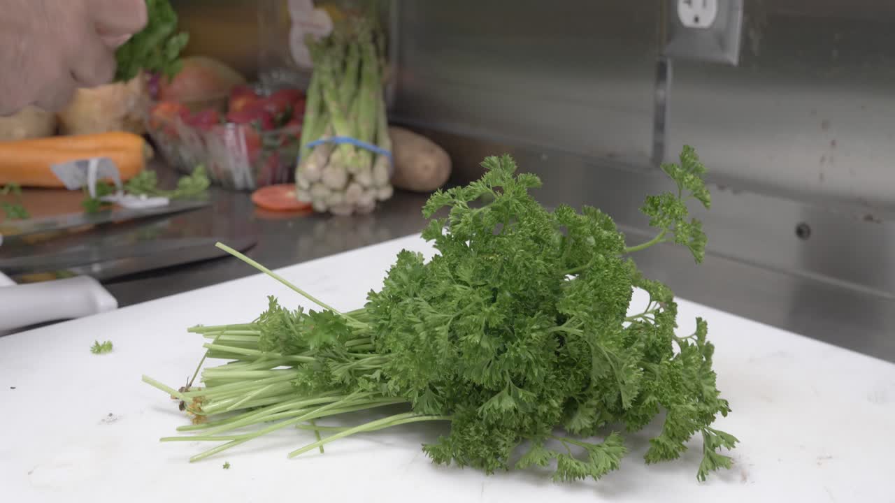 Up close shot of chef hands chopping up cilantro