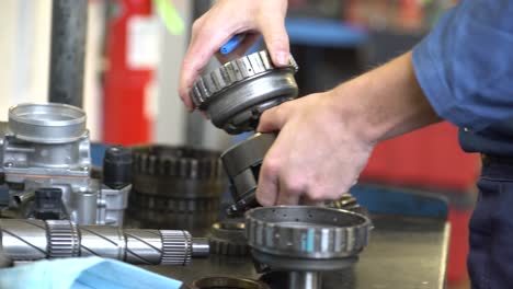 Inmates-prisoners-working-in-mechanic-shop-on-cars-and-vehicles-learning-trades-4k