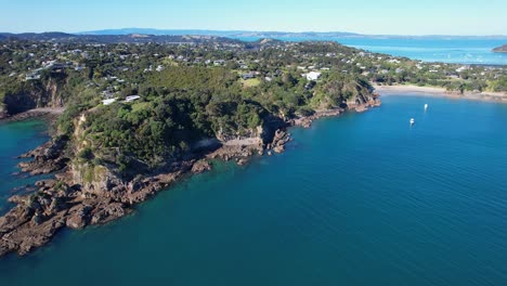 fishermans rock and newton reserve on oneroa bay in waiheke island, new zealand