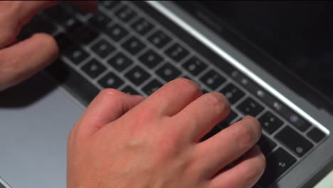 close-up office typing on a laptop keyboard in the office