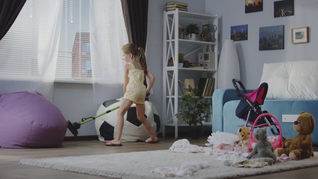 Little Girl Cleaning Up Toys in the Living Room