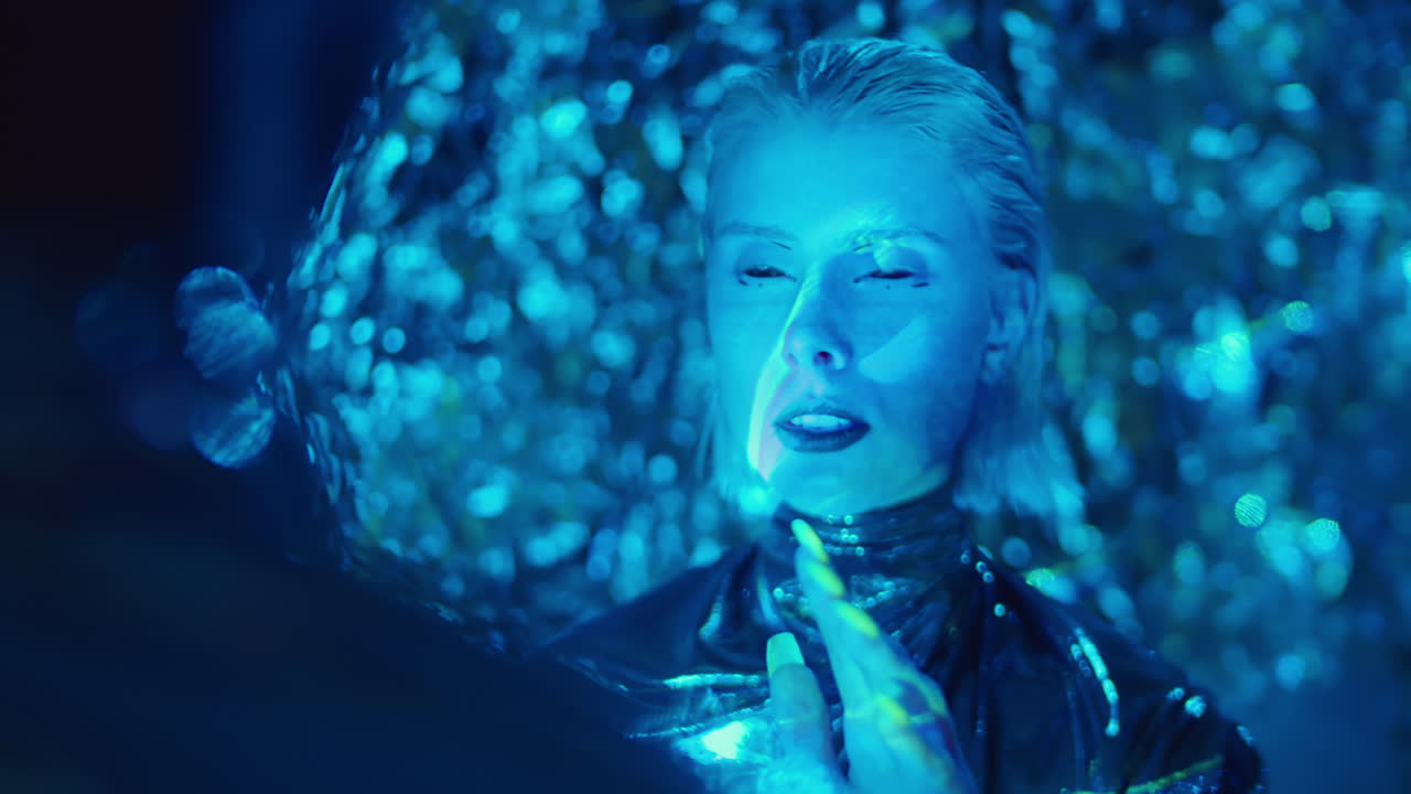 Alien Woman Talking to Man in Studio with Laser Light