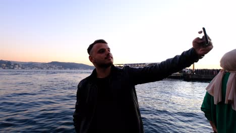 man take a selfie in bosphorus