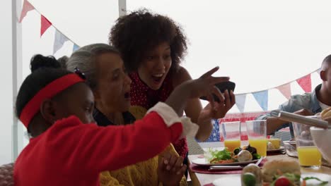 multi-generation family having celebration meal