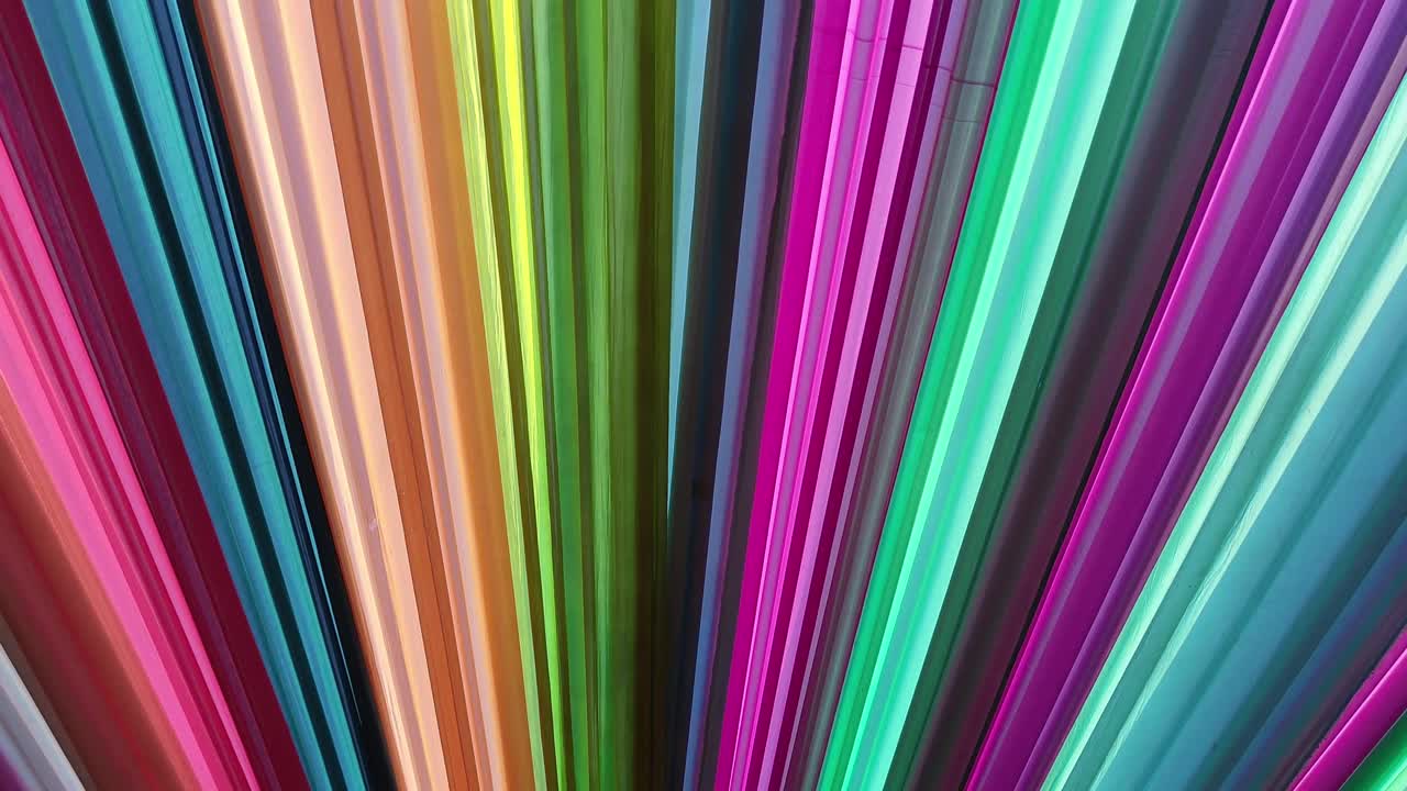 Stock footage of stunning wedding decoration featuring multicolored fabric drapes arranged in radial pattern. Perfect for Indian weddings, festive celebrations, mandap decor, and luxury event themes.