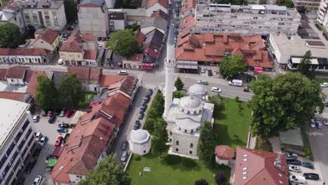 aerial orbiting shot of ferhadija mosque, famous mosque in banja luka city, bosnia and herzegovina