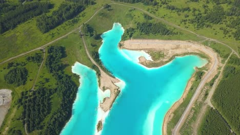 top down aerial view of glowing nuclear lake in russia,radioactive chemical vibrant color