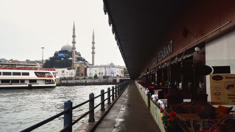 view of istanbul from galata bridge on the bosporus strait.with yeni mosque in the background, turkey