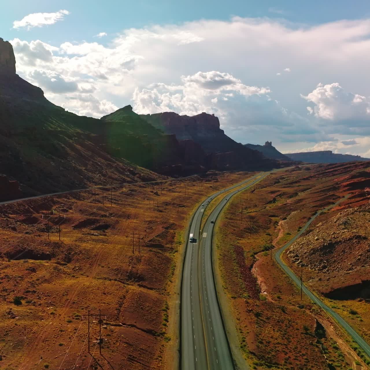 Motorway through the valley among beautiful rocks. Stunning Utah canyons in the rays of summer sun