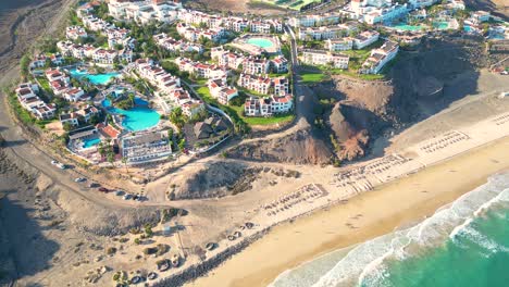 Aerial-view-of-a-luxury-hotel-along-the-coast-Hotel-Princess-Fuerteventura,-Canary-Islands,-Spain