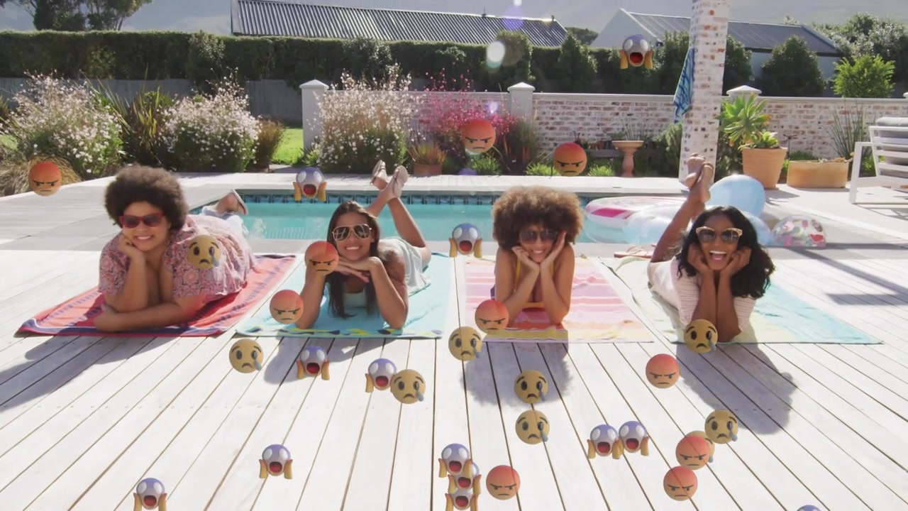 Happy Diverse Friends Sunbathing on Poolside Deck