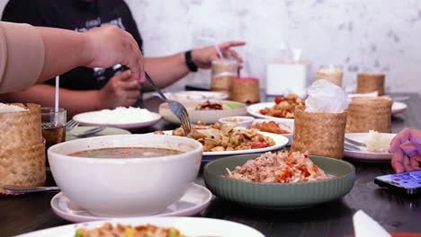 friends enjoying a meal together in bangkok