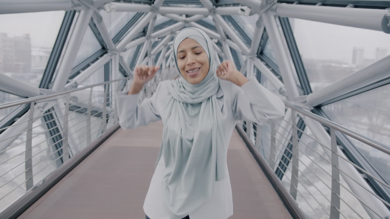 Happy Woman Running on a Modern Bridge
