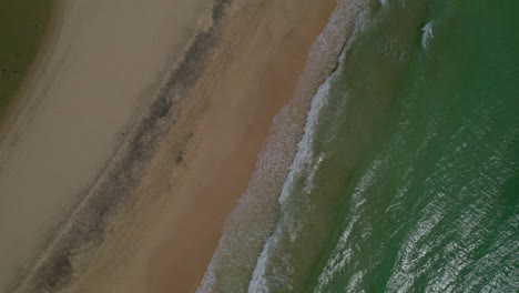 Sotavento-Beach,-Fuerteventura:-wonderful-overhead-aerial-shot-over-the-shore-of-the-fantastic-beach-on-a-sunny-day