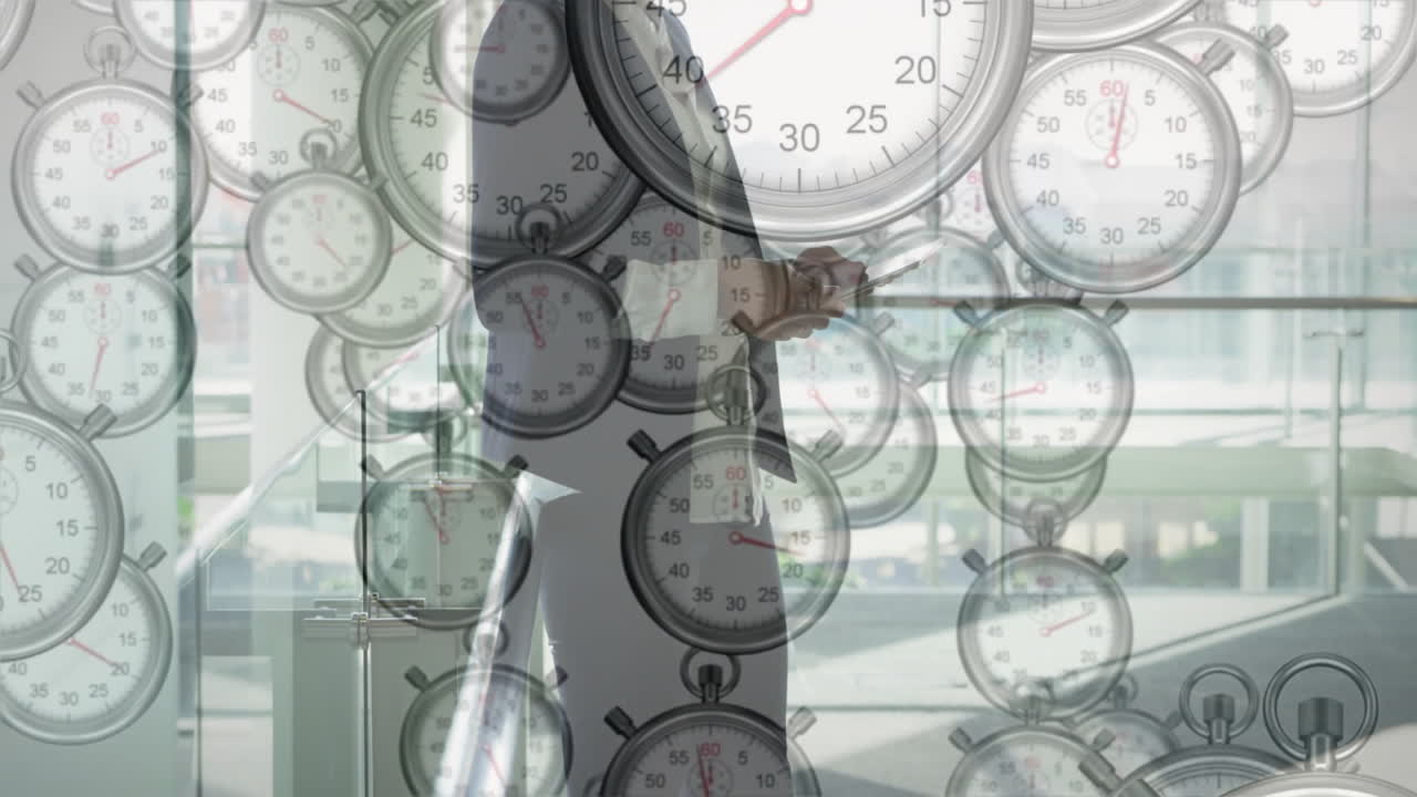 Stopwatches animation over businessperson walking in office