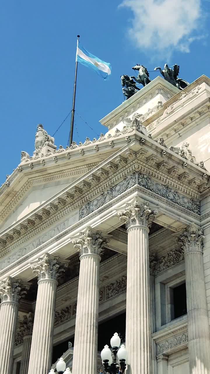 Vertical view of the National Congress building, Argentine flag over the Sky, chamber of Deputies