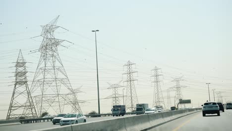 highway with power lines and traffic