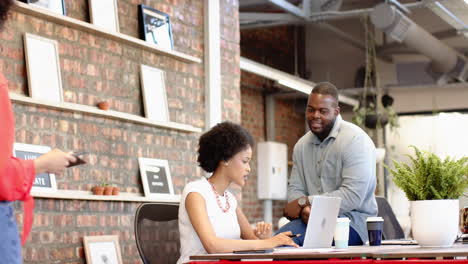 a diverse group of business colleagues working together in modern office