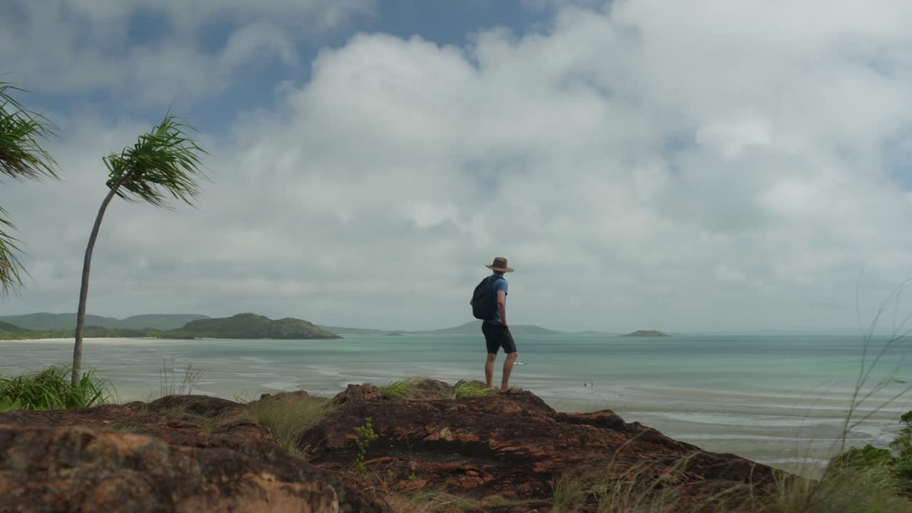 The landscape at the northernmost point of Australia, known as Pajinka, or The Tip, in Cape York. A man is exploring. Clip 7