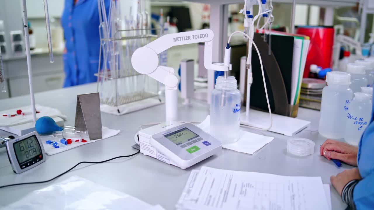 Scientist working in lab. View of scientist working with chemicals in laboratory
