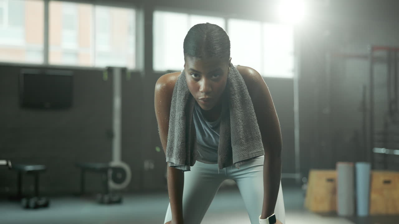Exhausted woman after a workout in the gym