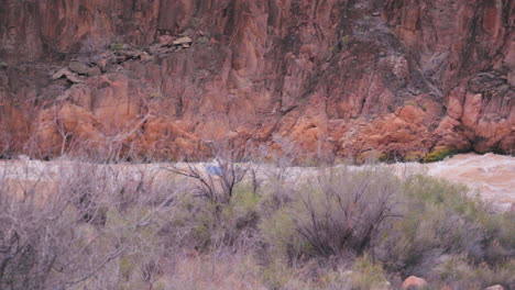 tourists during recreational activity - river rafting over grand canyon rapids in arizona