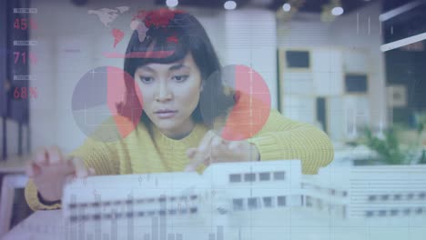 animation of data processing over biracial businesswoman working in architect's office