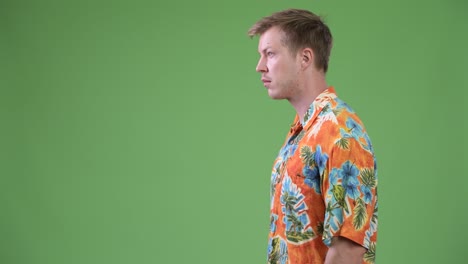 profile view of young handsome tourist man
