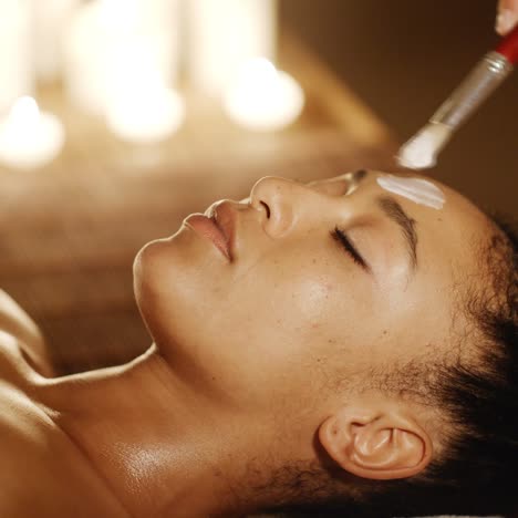 woman with clay facial mask