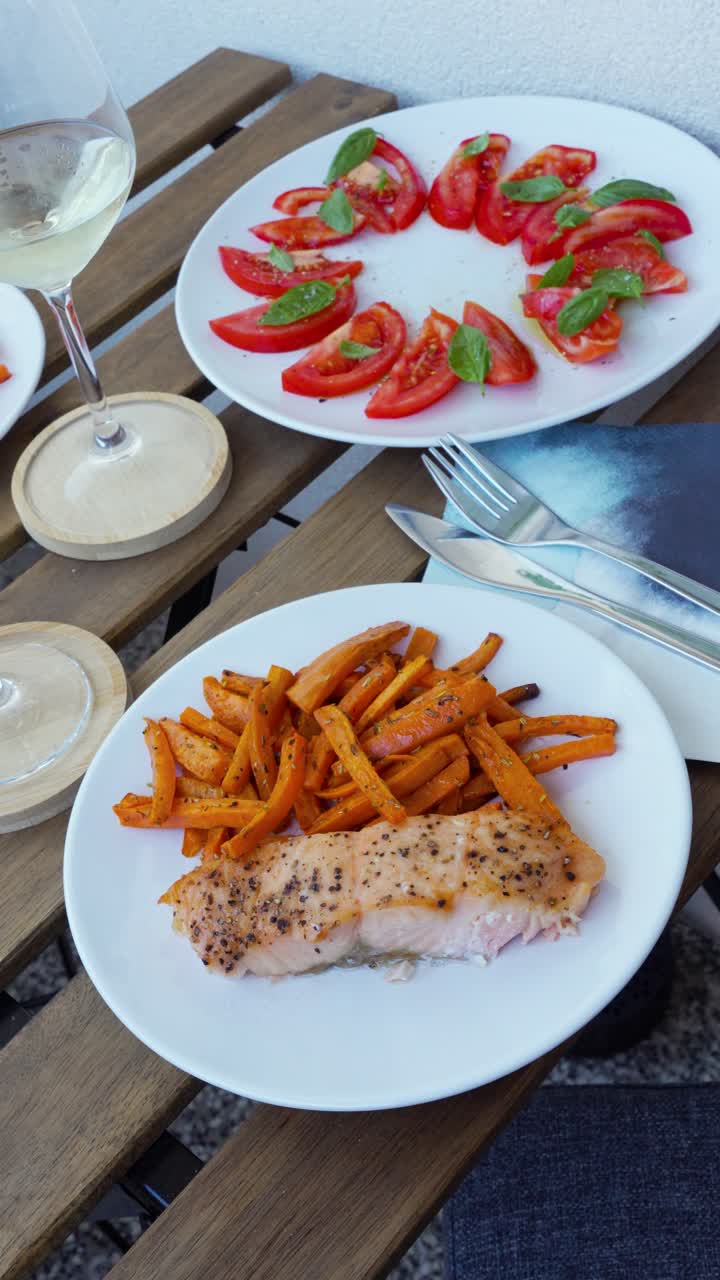 Vertical Shot Of Delicious Meal, Dishes On Table With Fries Salmon Fish And Tomato Salad