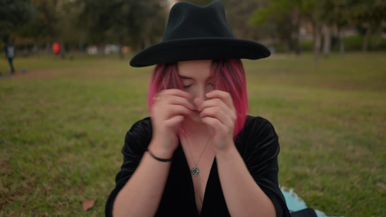 Woman with Pink Hair in a Park